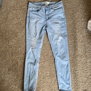 light blue ripped jeans